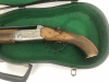 Fucile a canne mozze a doppia canna / pistola da carrozza in custodia di violino.