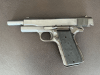 .45 ACP 1911 A1 pistol with movable slide, hammer and trigger.
