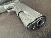 .45 ACP 1911 A1 pistol with movable slide, hammer and trigger.