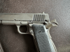 .45 ACP 1911 A1 pistol with movable slide, hammer and trigger.