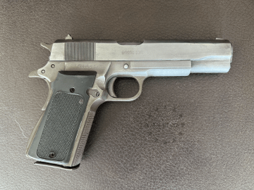 .45 ACP 1911 A1 pistol with movable slide, hammer and trigger.